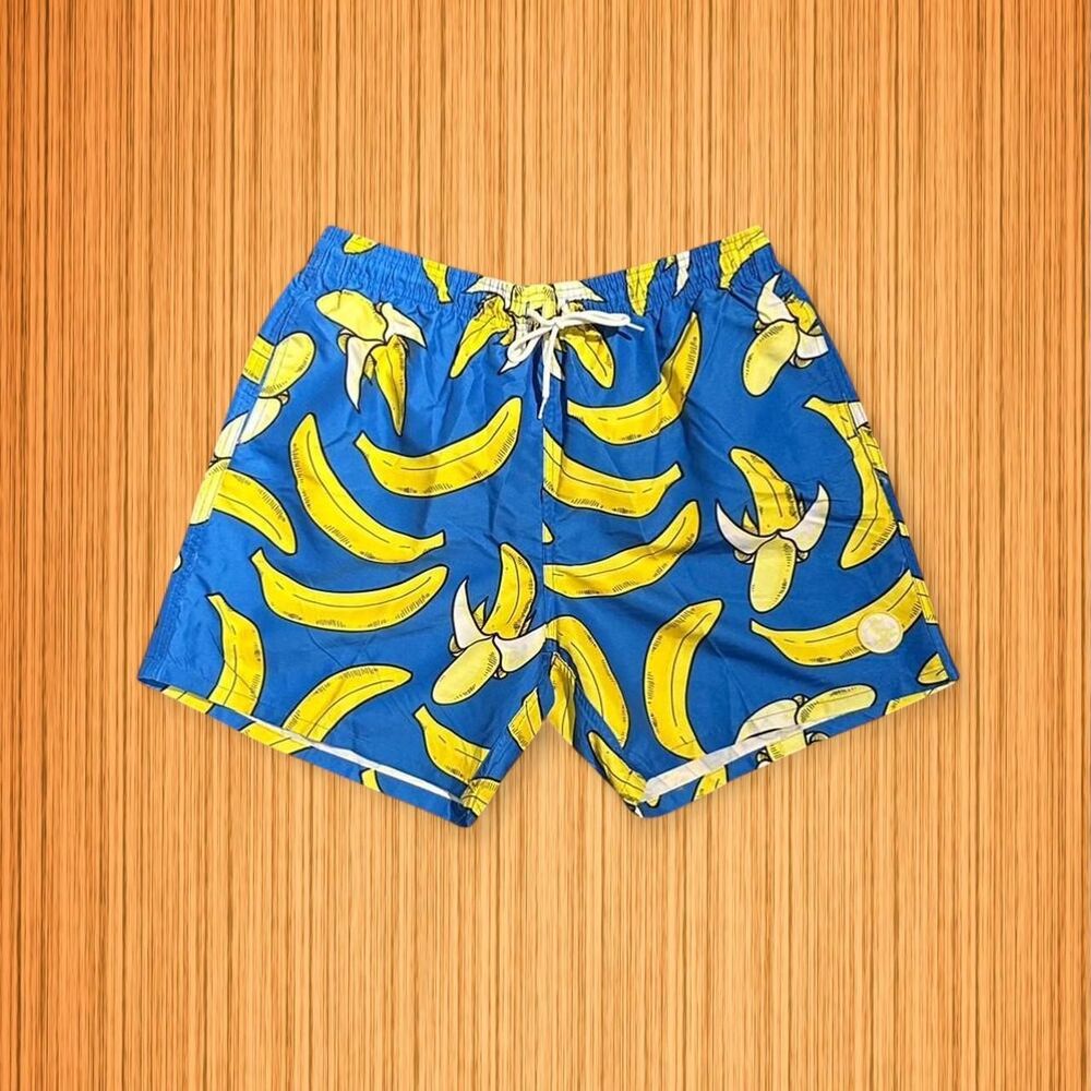 Blue swim trunks featuring a fun banana print from Uzzi